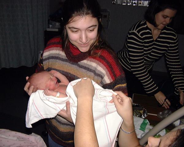 Megan gets to hold the baby